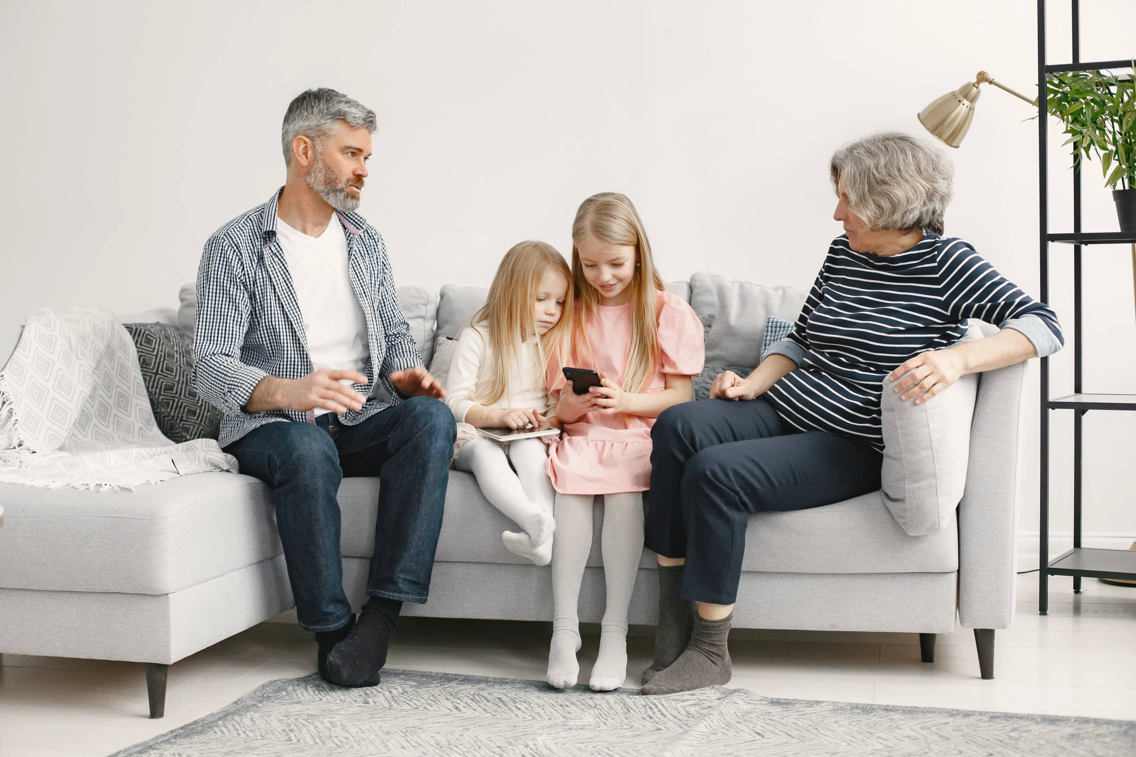 Family relaxing together on a couch at home